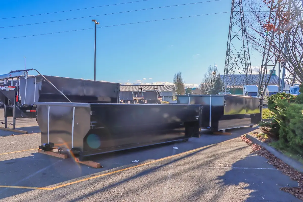 Roll-off dumpster ready for waste disposal at job site for 3 Yard Dumpster Rental in Medfield